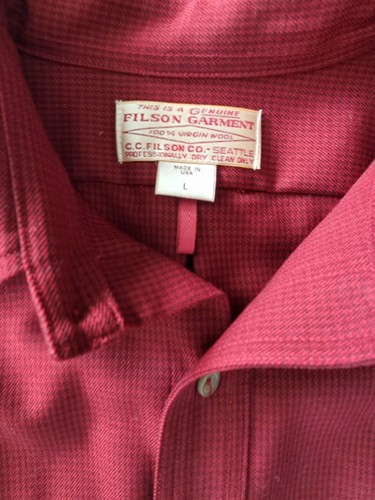 Red Filson Virgin Wool shirt, size L, with white label showing company name and “Made in USA” text.
