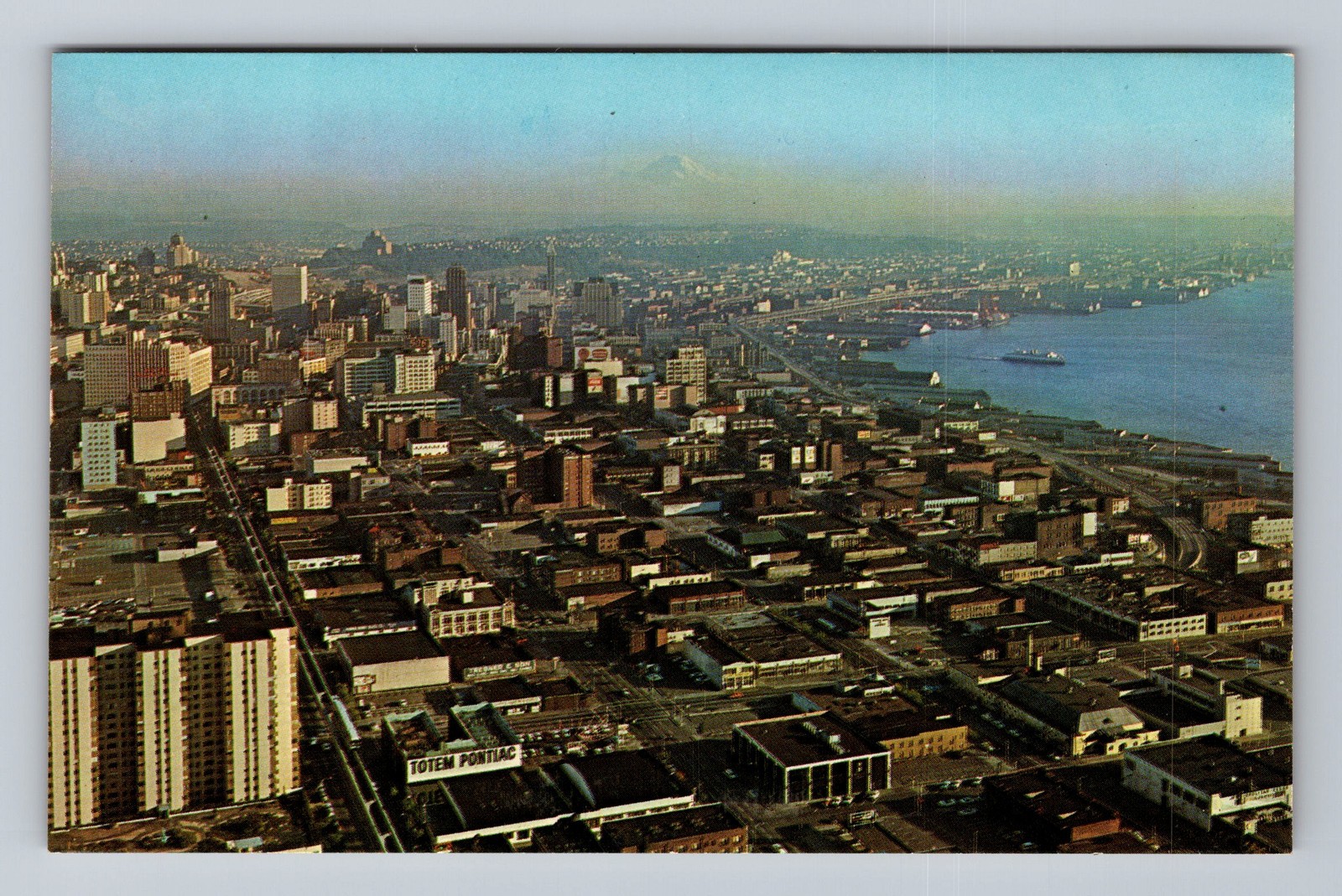 Vintage Seattle WA aerial postcard featuring Space Needle cityscape