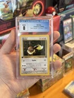 Eevee 1st Edition Team Rocket CGC 8 NM/M Pokemon TCG