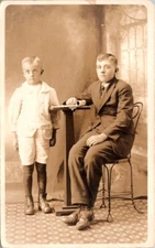 RPPC Postcard Studio Portrait Young Boys at Small Table            12687