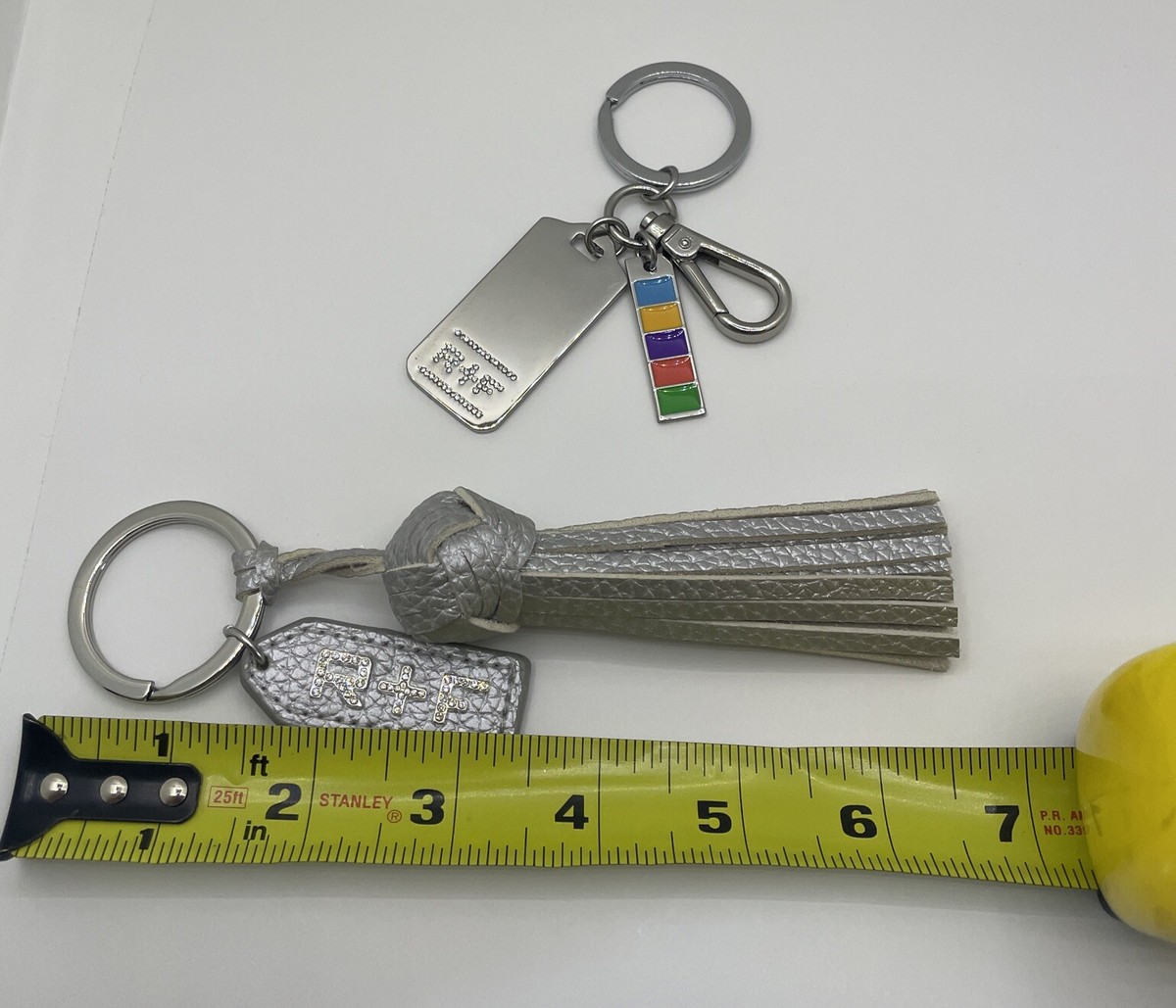 Rodan and Fields Silver Leather Tassel, Tag, And Signature R&F