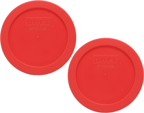 Two red Pyrex 7200-PC 2-cup food storage replacement lids with black logo and white circular text on top.