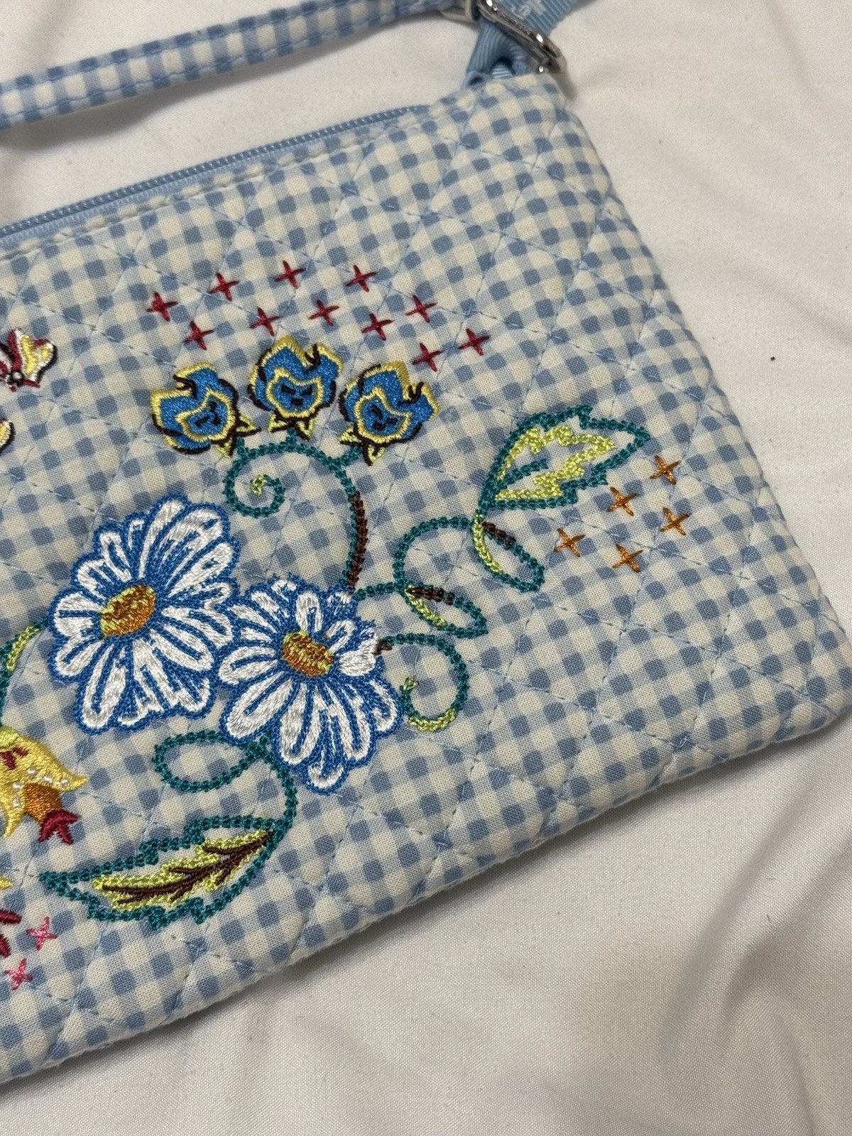 Vera Bradley’s Disney RFID Convertible Wristlet, featuring “Alice in Wonderland”