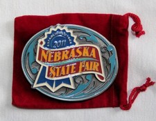 VINTAGE 2011 NEBRASKA STATE FAIR BELT BUCKLE WITH CLOTH BAG, 56 0F 2500