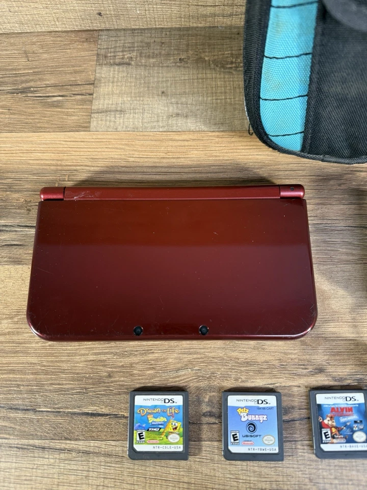 Consola Nintendo NUEVA 3DS LL XL Roja Metálica con Cargador, Juegos y Estuche - Probada Foto 2 de 4