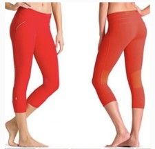 Athleta relay Women s Running Capri Pants Coral Mesh Insets, size small