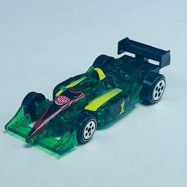Transformers action figure robot toy Hasbro 2000 mini green race car