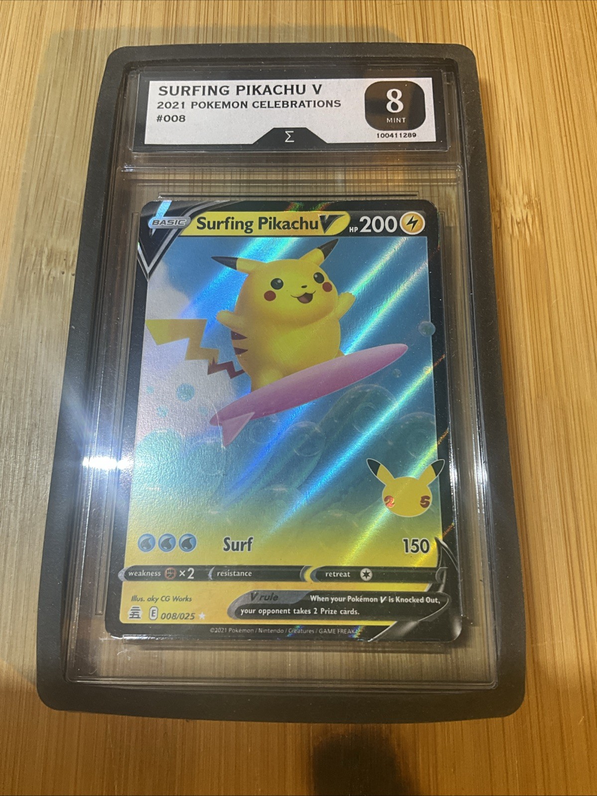 Surfing Pikachu V 2021 Pokemon Celebrations 008/025 Holo CGC 8