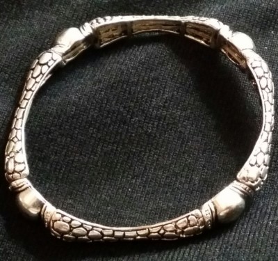 Silver coated bracelet on stretchy cord, just a few years old, in great shape