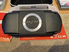 PSP-1003 games console in original box and 7 games bundle