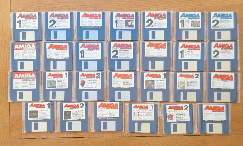 27 Amiga Shopper magazine coverdisks, still sealed in their original bags.