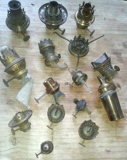 Many old small burners for kerosene lamps