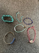 6 bracelets for kids several are blue and one is reddish color