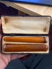 tres jolie ancien fume cigarette en bakelite ambre