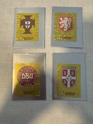 Netherlands, Denmark, Serbia And Portugal Team Logos 2022 Panini Gold Stickers.