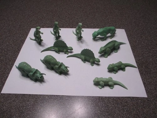 ELEVEN VINTAGE MARX GREEN PREHISTORIC DINOSAURS