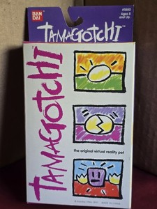 BANDAI TAMAGOTCHI 1997 version #1800 Purple with blue, new sealed box
