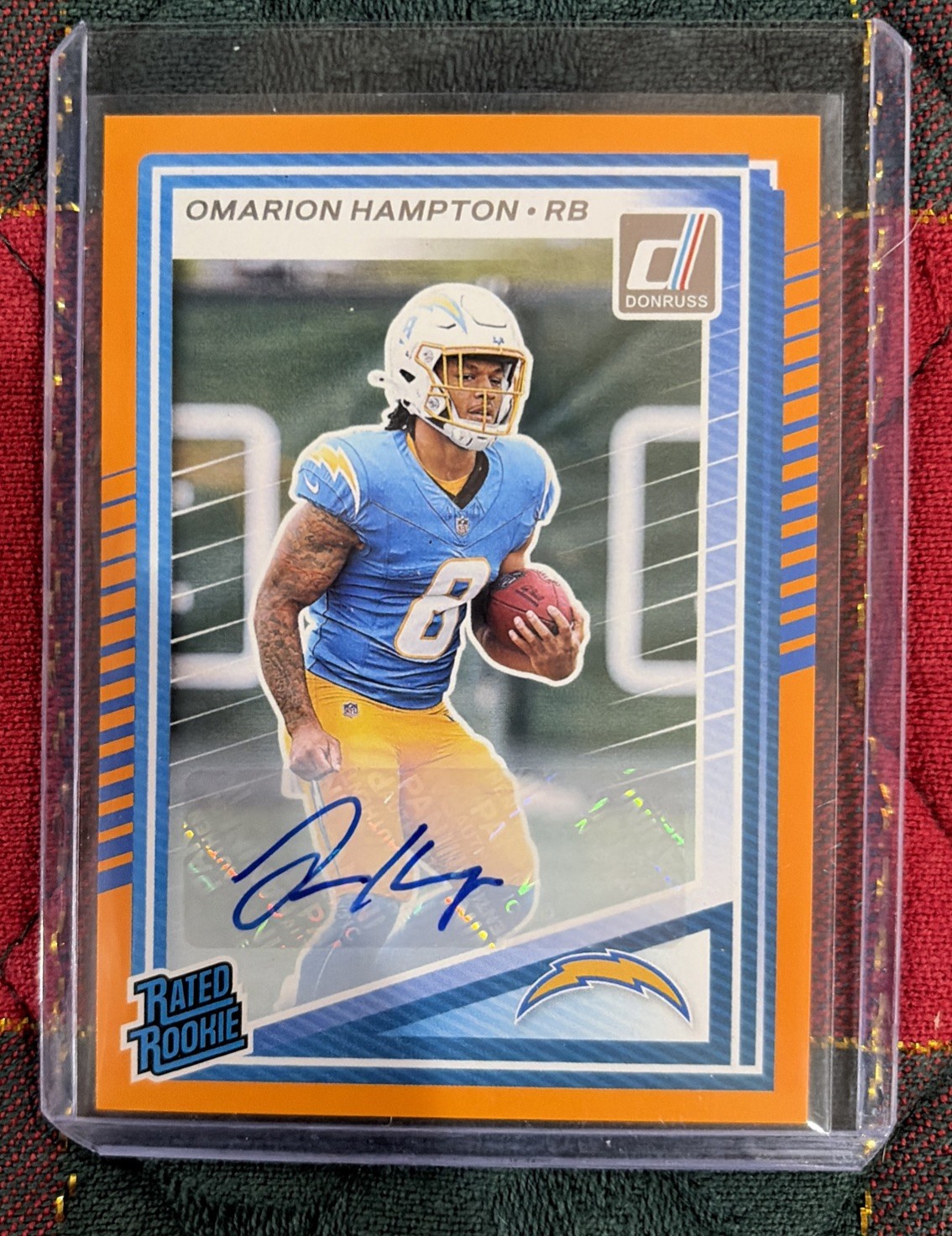 2025 Panini Donruss - Rated Rookie Omarion Hampton Orange Auto #303 RC SP