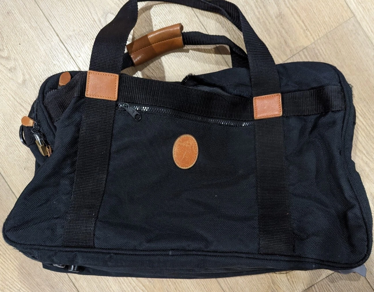 Sac de voyage Christian Dior toile noire vintage poignées cuir années 80 rétro