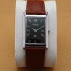 Vintage Seiko Slim Quartz Men's Wrist Watch Black Dial with Light Brown Strap.