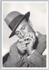 Gary Cooper lighting a cigarette - Publicity Photo Postcard
