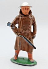 Barclay Manoil Soldier In Trench Coat Holding Riffle Downwards . Tin Helmet. B47