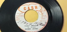 RARE/ DOBBY JONES - LEAVE BABYLON  Roots /REGGAE 45"  on CASH   LABEL