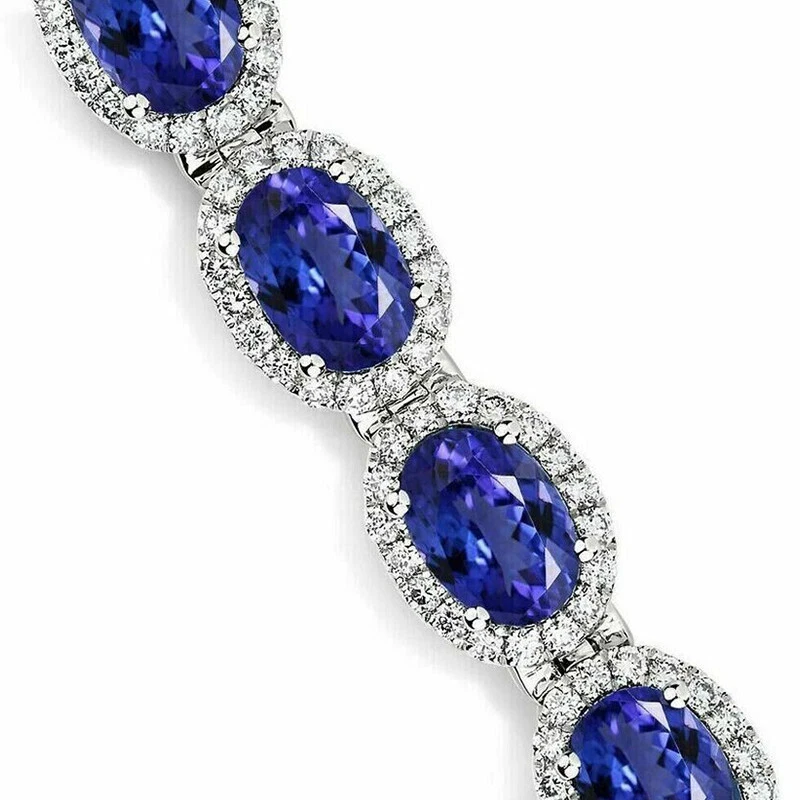 Brazalete de tenis con halo de diamantes de tanzanita azul corte ovalado de 15 quilates acabado en oro blanco de 14 quilates Foto 2 de 4