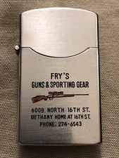 Vintage Advertising Lighter FRY’S GUNS and SPORTING GEAR - by Dundee PHOENIX, AZ