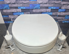 KOHLER Hyten Elevated Quiet-Close Round-Front Toilet Seat in White