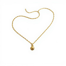 Colgante o dijes estrella de luz Sunburst de oro amarillo de 14K
