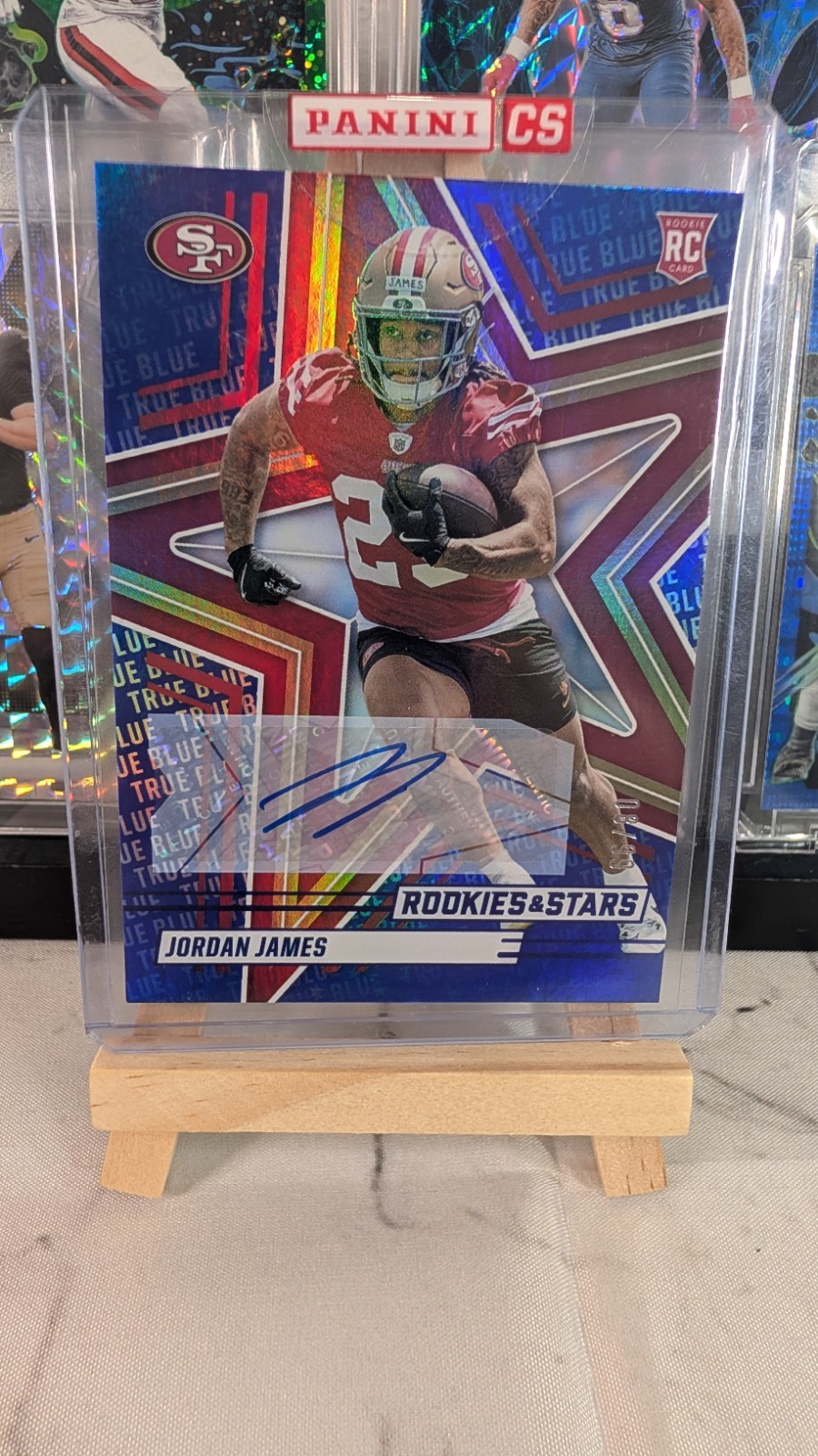 2025 Panini Rookies & Stars - Rookies Jordan James #144 True Blue Signatures /99