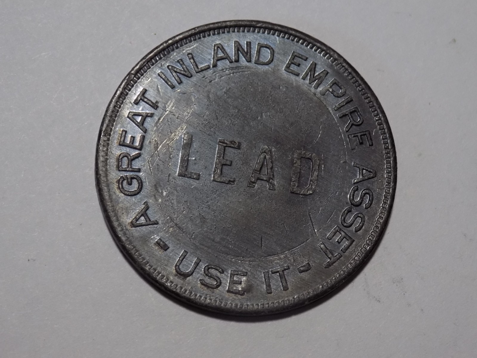 A GREAT INLAND EMPIRE ASSET / LEAD / USE IT - USE MORE / LEAD PLUMBING - 39mm