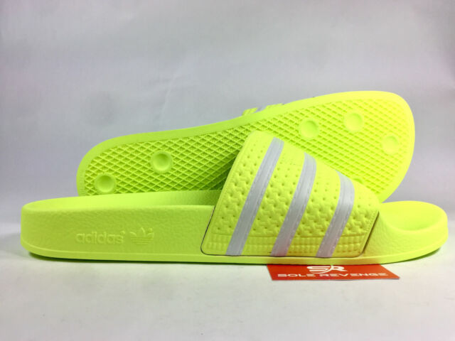 yellow adidas flip flops