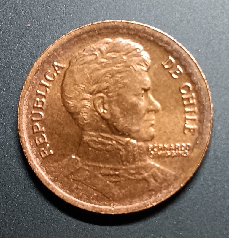 1954 Chile Peso. Appears Uncirculated. Beautiful Coin with a bit of Toning.