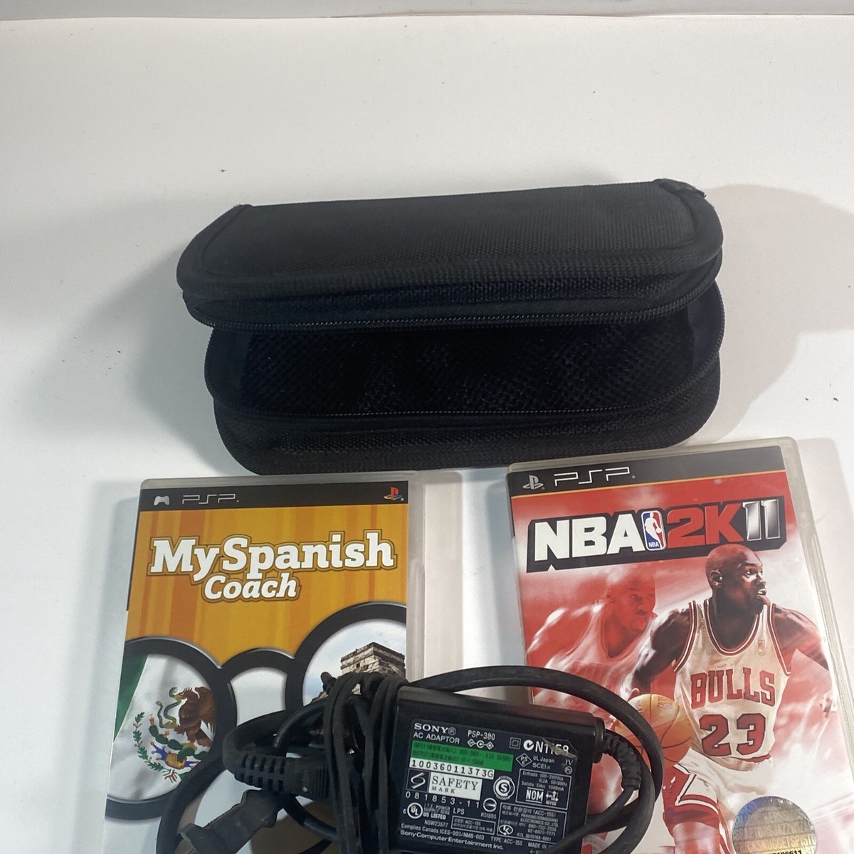 SONY PSP 1001 WITH GAMES/ Charger/ Case No Battery Or Memory