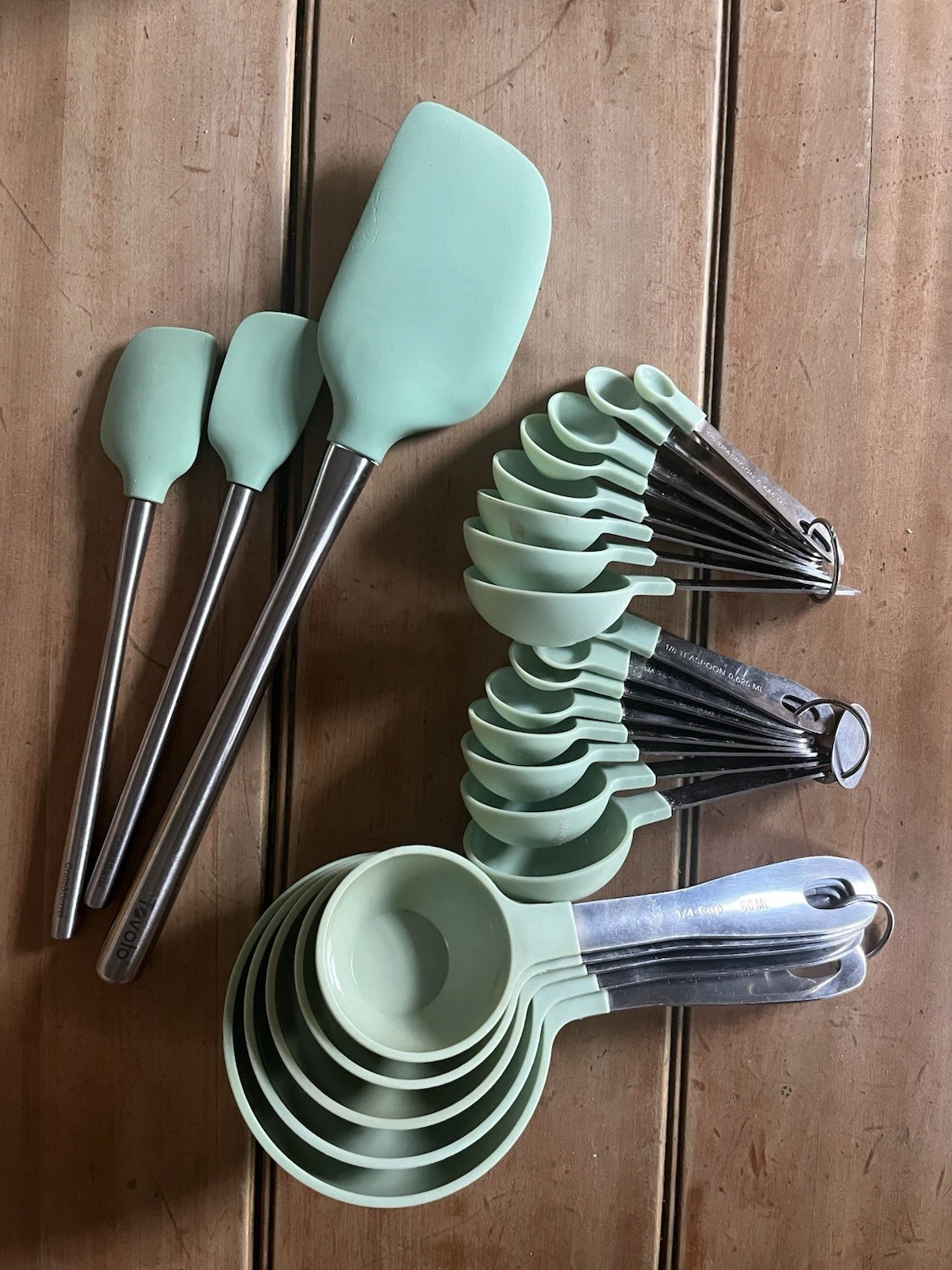 Used measuring cup and spoon with spatulas set mint green Crate & Barrel ￼
Opens in a new window or