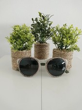 Gafas de sol redondas con montura clara