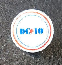 DC-10, VINTAGE GOLF BALL MARKER. RED, BLUE BORDER. ADVERTISING SOUVENIR