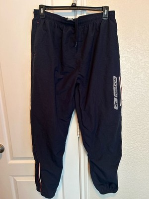 Vintage Reebok Navy Blue Nylon Track Pants with Leg Zippers and Logo Detail