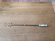 incl. postageLong brass decorative fork with porcelain decor.