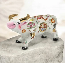 Porcelain figurine of a decorative Chinese zodiac ox with floral motifs