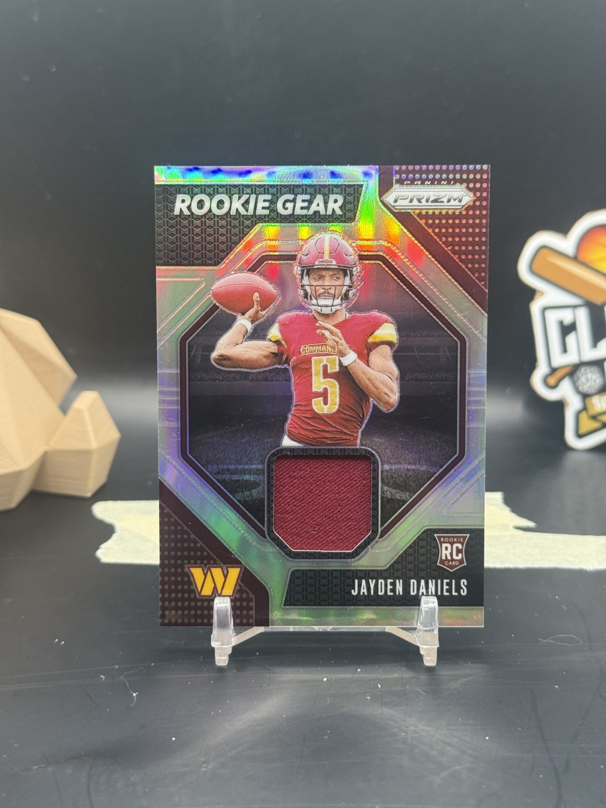 Jayden Daniels 2024 Prizm Silver Rookie Gear Patch Commanders (CBR)