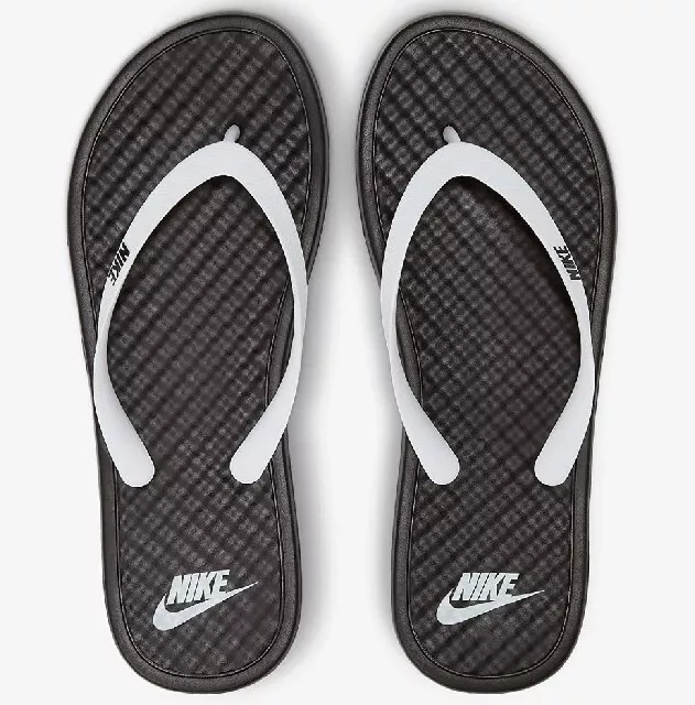 Black and white hotsell nike flip flops