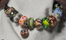 Trollbeads unique green facet orange purple b...