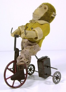 1910s GEBRUDER BING CAST IRON WIND UP TRICYCLE WITH MOHAIR MONKEY RIDER BIKE