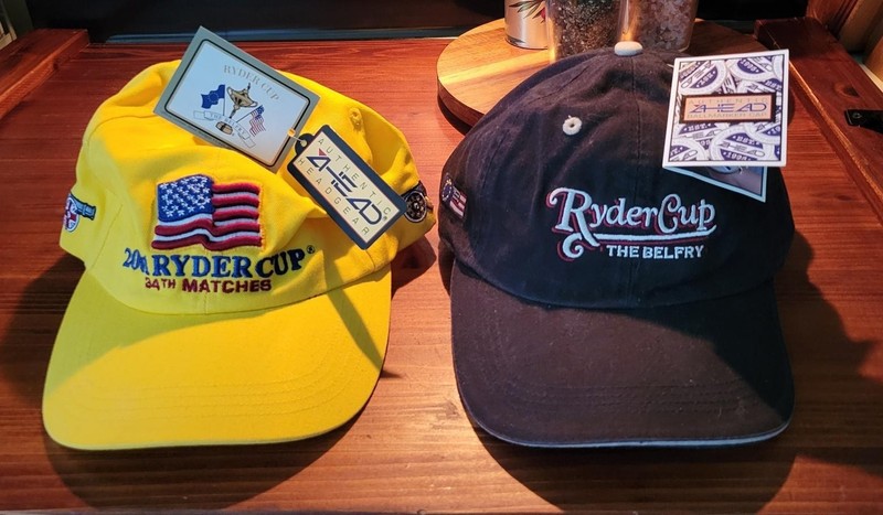 2 Vintage 2001 Ryder Cup Caps - 34th @ Belfry. One (1) has ball marker attached.