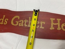 Adorable Home decor: Red, farmhouse style "Friends And Family Gather Here" sign