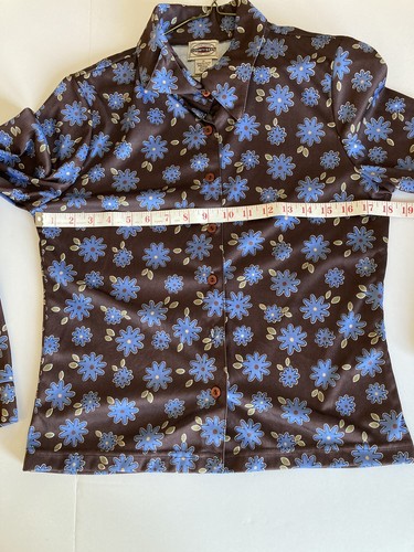 Brown and blue County Seat ladies shirt size M with floral print, laid flat with measuring tape along neckline.