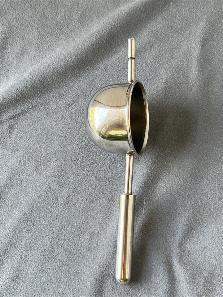 A beautifully crafted Italian silver-plated rollover jigger — a functional vintage bar tool that's also a sculptural conversation piece.